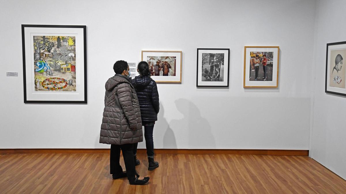 A group of artists and other in the community are upset with city plans to change arts funding. They want more transparency in the process. Seen here, museum-goers view the “Vision & Spirit: African American Art” exhibit at the Harvey B. Gantt Center for African-American Arts + Culture.