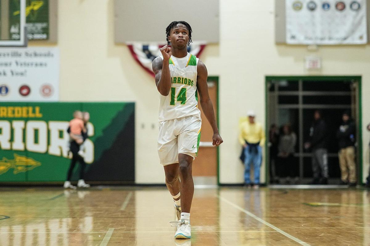 West Iredell’s Jordan Patterson (14) pumps his fist during the second half of a varsity basketball game against St. Stephens Friday, Dec. 20, 2024, in Statesville, N.C. (Charlotte Observer /Matt Kelley)