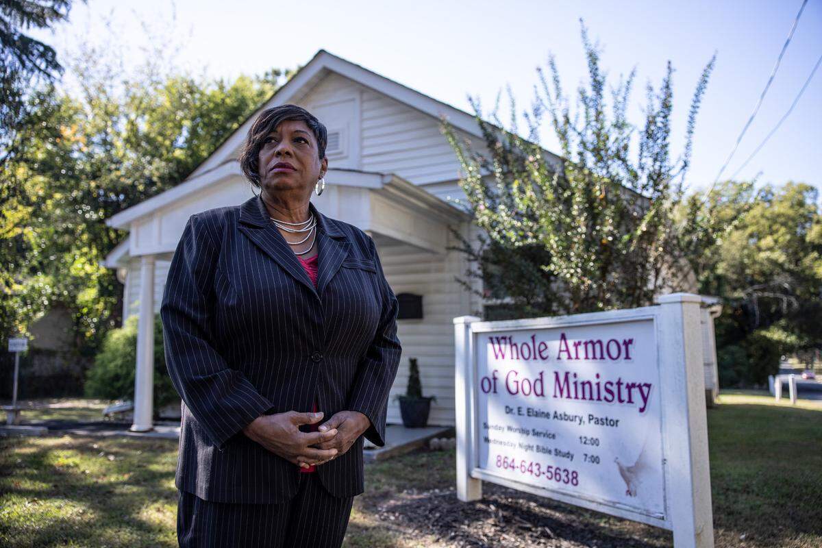 Elaine Asbury, pastor of Whole Armor of God Ministry, poses for a portrait in Charlotte, N.C., on Monday, October 18, 2021.