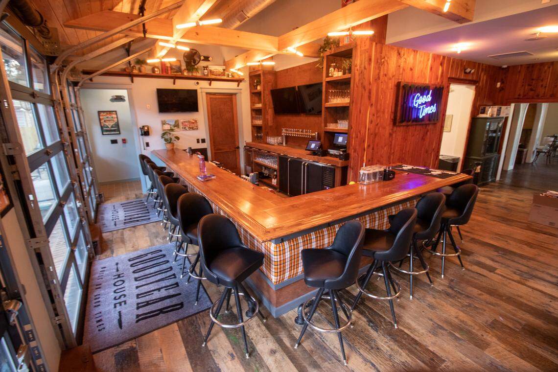 The bar at The Goodyear House, shown in January 2020, is now warm and nostalgic with 1970s knickknacks and garage doors that open to the backyard patio.