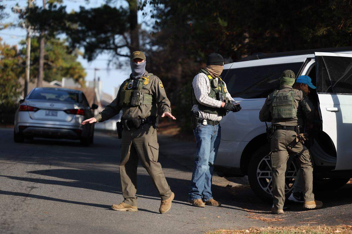Border Patrol agents seen arresting a man in southeast Charlotte on Sharonbrook Drive who was walking back to his home  Sunday morning, Nov. 16, 2025.