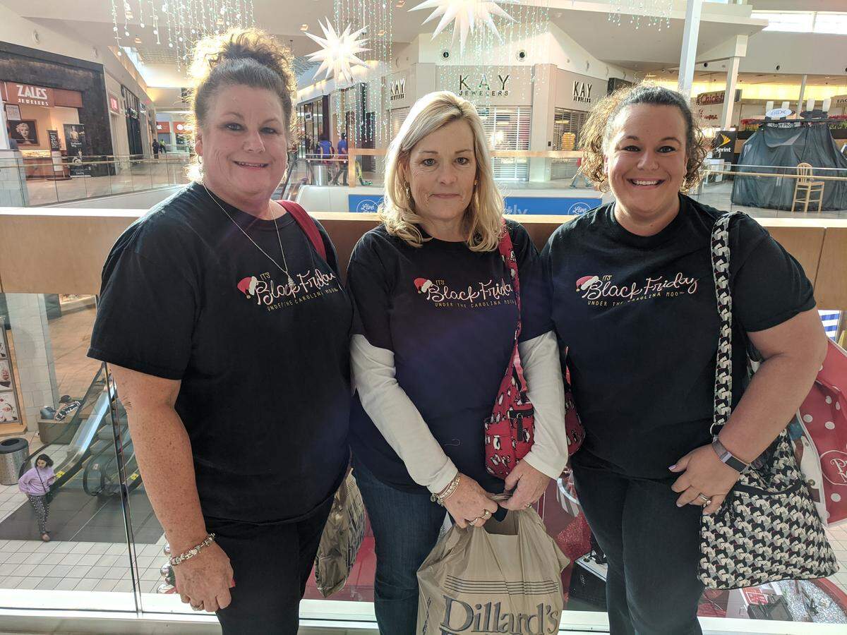 Black Friday shoppers from left Missy Russell, Darlene Hathcock, both of Albemarle, and Kelly Williams of Cornelius, said deals and tradition brought them out when Northlake Mall opened Nov. 29.