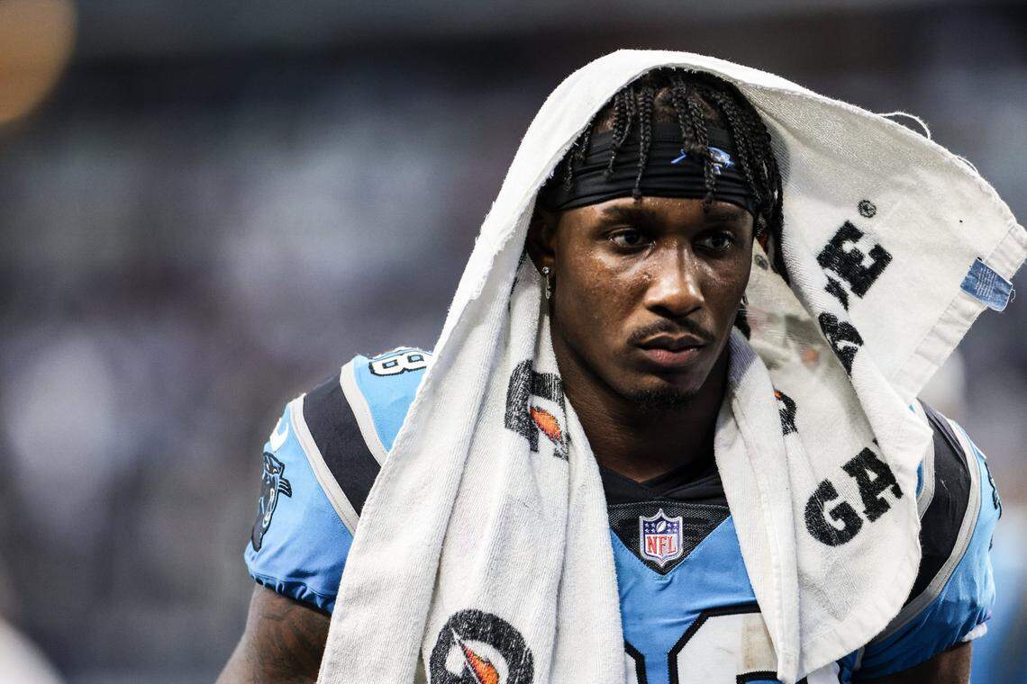 Carolina Panthers Terrace Marshall Jr. wears a towel on his head as he leaves the field after a loss to the Dallas Cowboys at the AT&T Stadium in Arlington, T.X., on Sunday, October, 3, 2021.