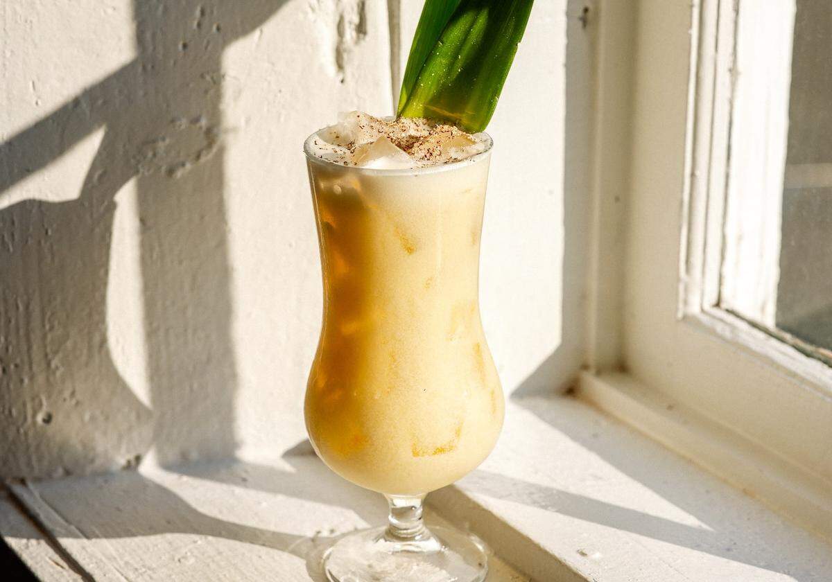 Muddy River Distillery’s Painkiller includes a pineapple leaf garnish.
