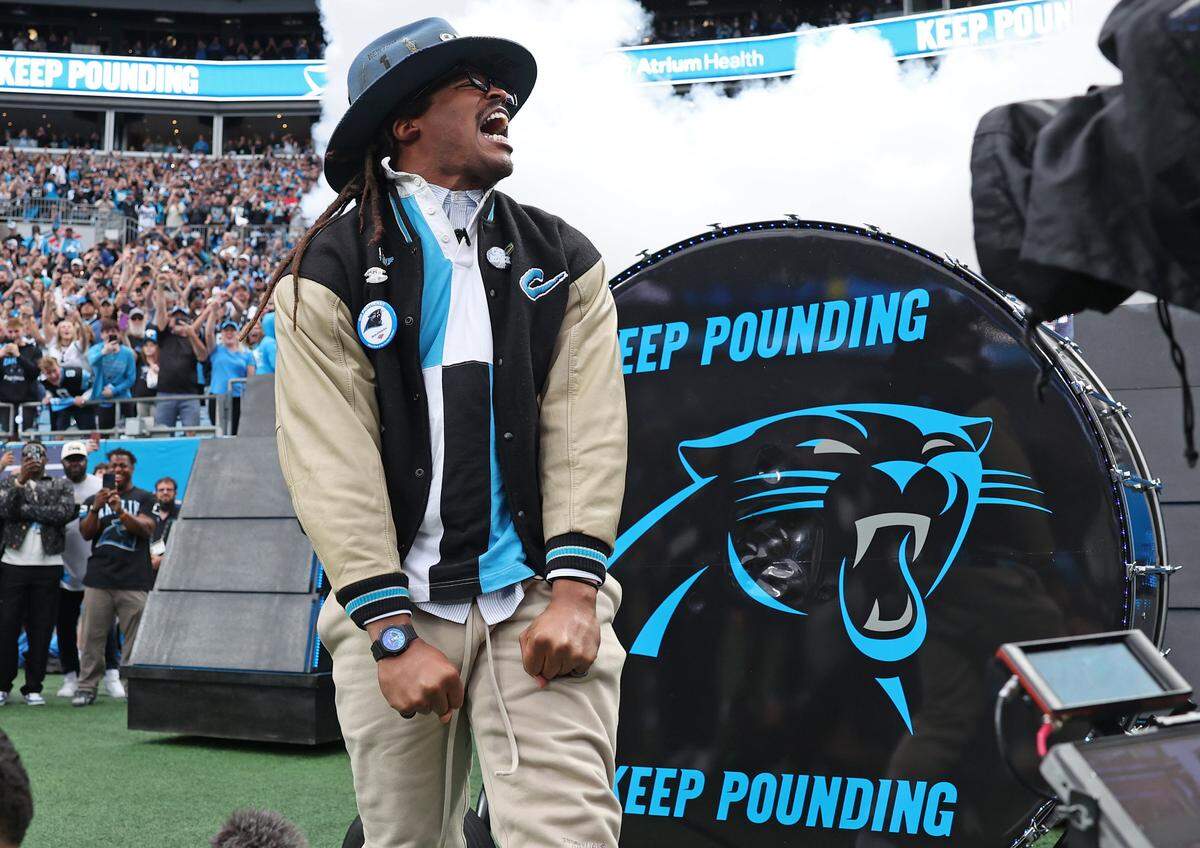Former Carolina Panthers quarterback Cam Newton screams after hitting the Keep Pounding drum prior to the team’s game against the Los Angeles Rams at Bank of America Stadium on Saturday, January 10, 2026. The Rams defeated the Panthers 34-31.