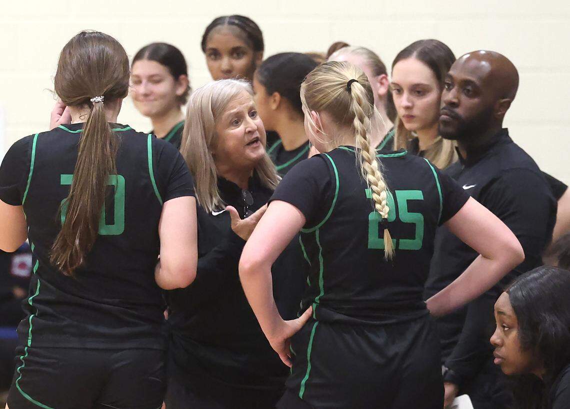 Myers Park head coach Barbara Nelson, center, speaks with Macie Porter, right, following a play against the Palisades Pumas on Tuesday, January 28, 2025 at Palisades High School.
