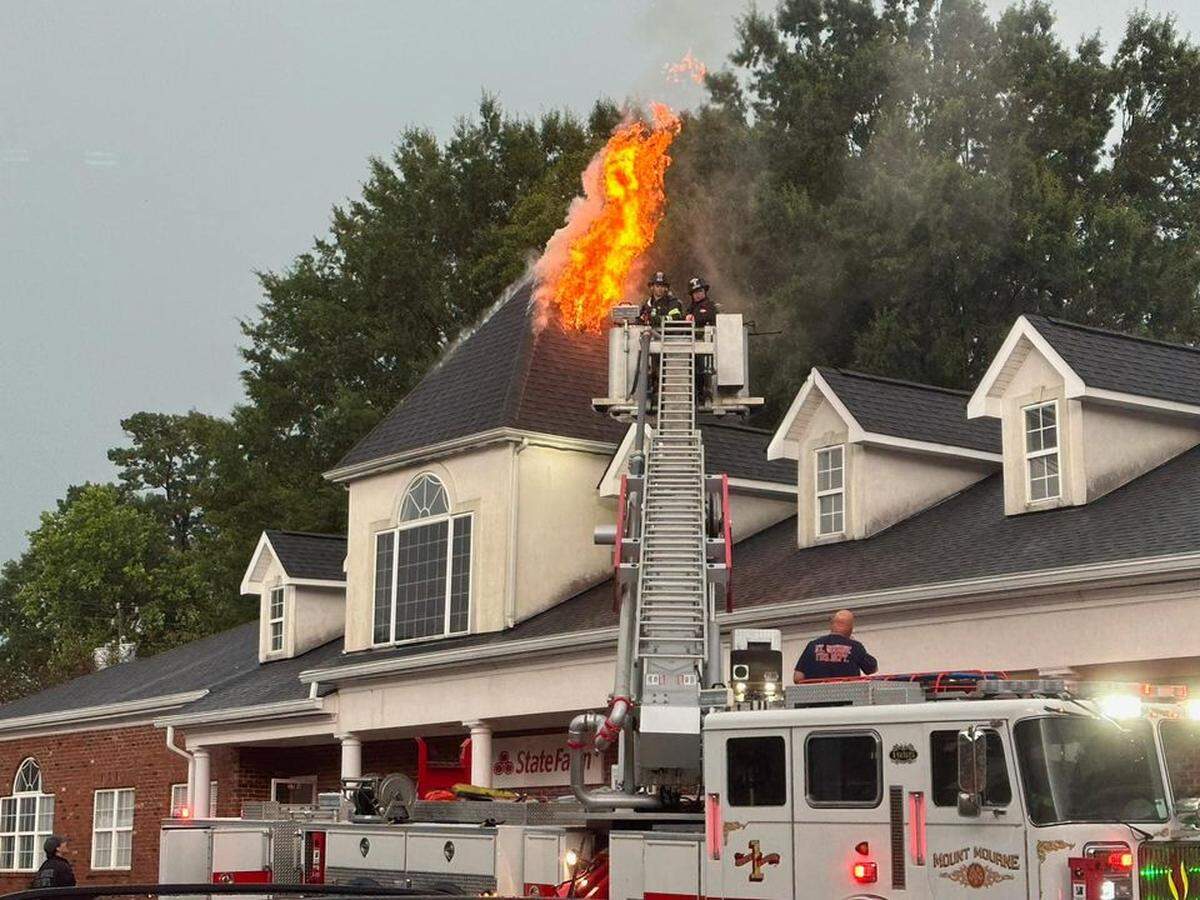 Flames from a lightning strike tore through a business on Williamson Road on Lake Norman in Mooresville NC during intense storms Monday, Aug. 8, 2023.