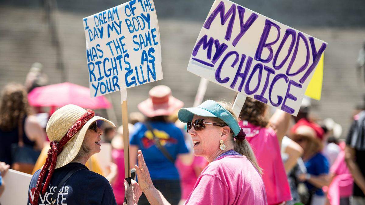 Nancy DeSisto, right, and Karin Sisk talk during the national “STOP THE BANS” day of action at the South Carolina Statehouse, Tuesday, May 21, 2019, in Columbia, S.C. The rally was one many held in all fifty states on Tuesday in response top recent state bans on abortion.