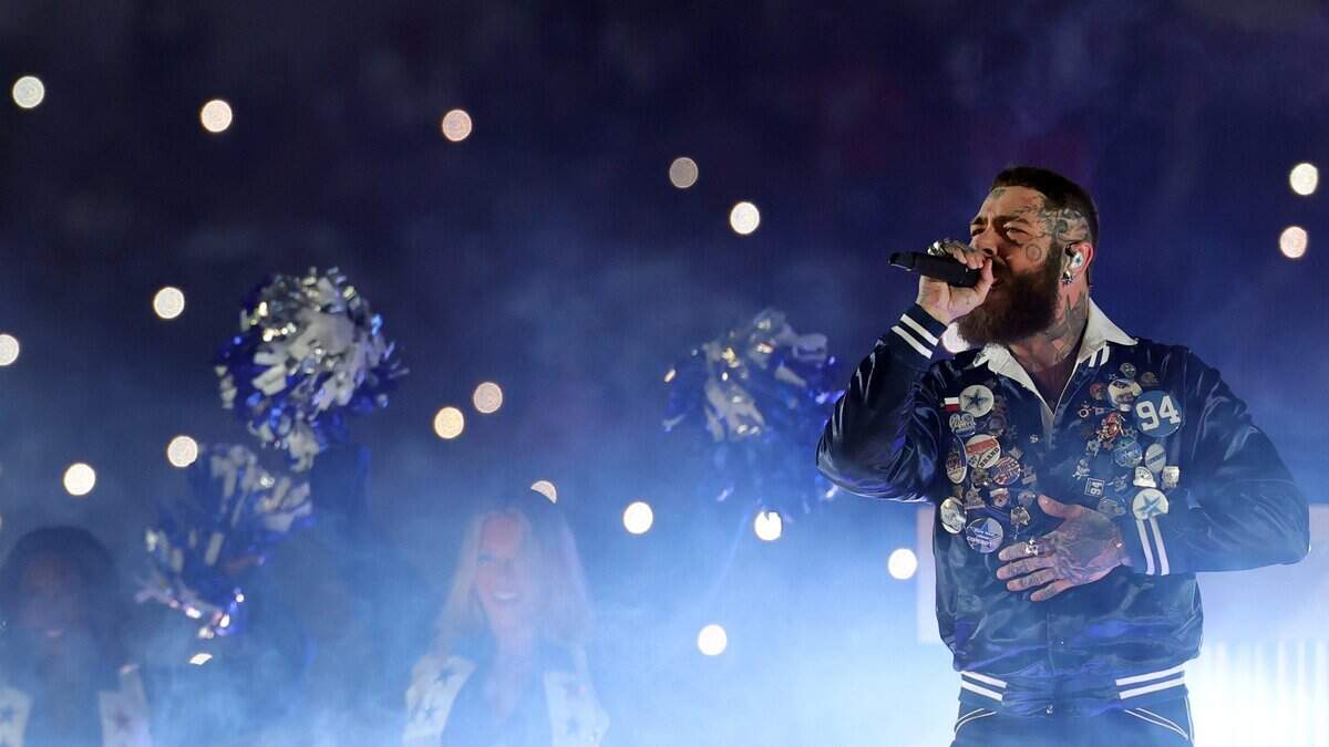 Post Malone performs at halftime of a game between the Dallas Cowboys and the Kansas City Chiefs at AT&T Stadium on Nov. 27, 2025, in Arlington, Texas. The Charlotte Observer photographed Tuesday night’s show at Bank of America Stadium, but the tour had not yet approved images by the time of this review’s publication.