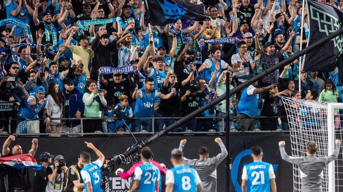 Charlotte FC fans react to players after a team win against the New England Revolution at Bank of America Stadium on Saturday, March 19, 2022 in Charlotte, NC. Charlotte FC defeated the Revolution, 3-1, for their first win of the season.