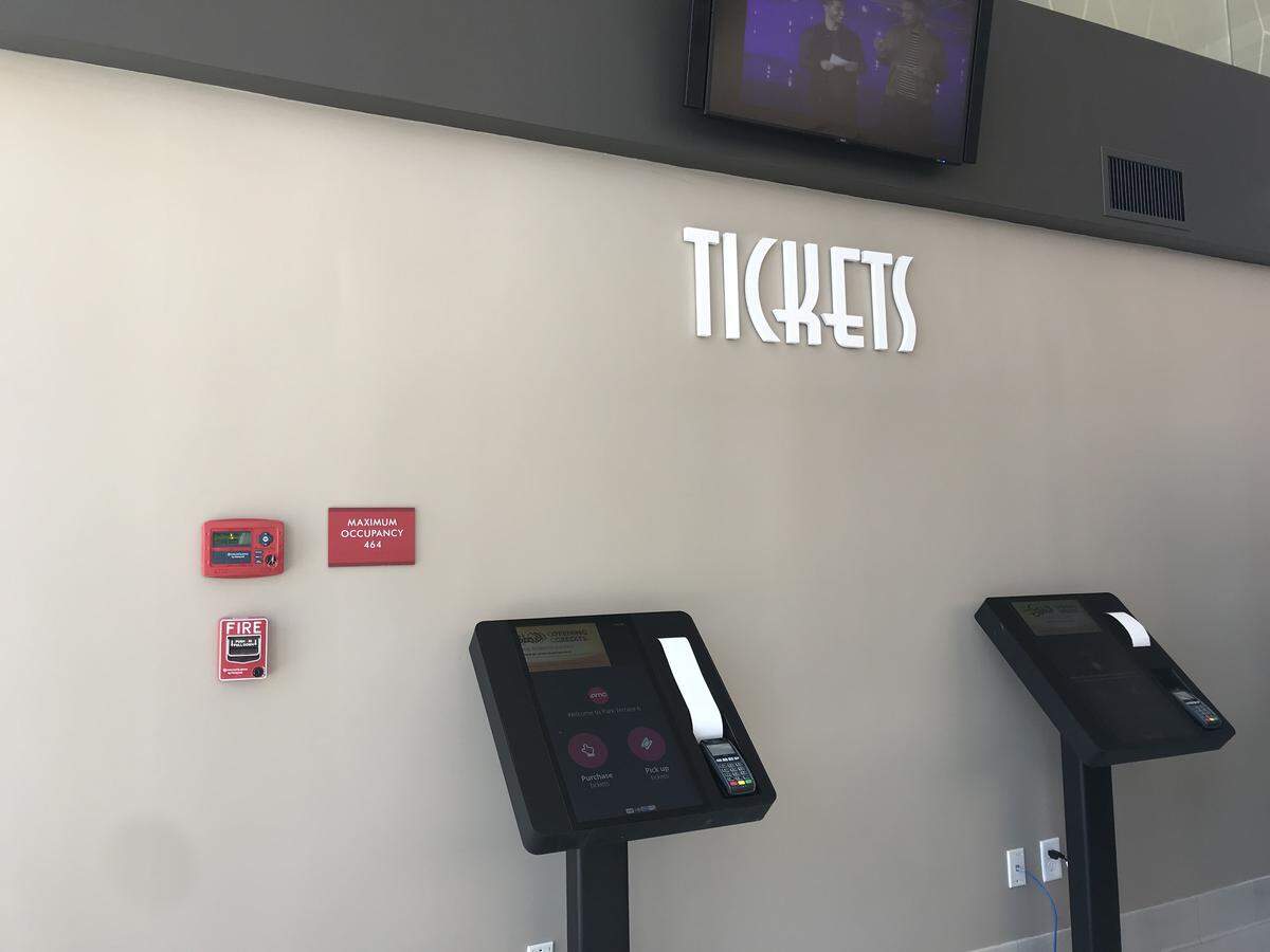At the renovated Park Terrace movie theater, the ticket box office has been replaced with automated ticketing machines near the concessions. The theater reopens Friday after a multimillion-dollar renovation.