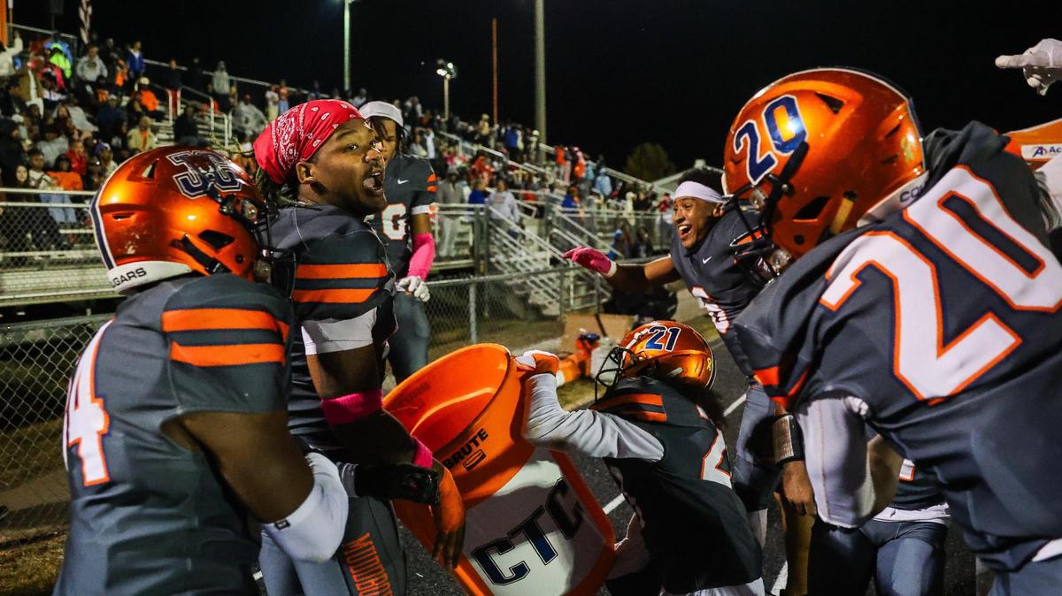 Chambers junior Adrian Scott (40, back left) celebrates with the team after returning a fumble for a touchdown against West Charlotte at Julian L. Chambers High School on October 20, 2023.