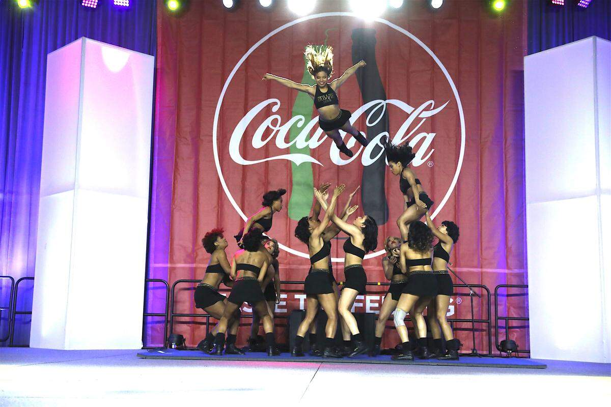 A cheerleading exhibition is among the activities during Fan Fest at the Charlotte Convention Center.