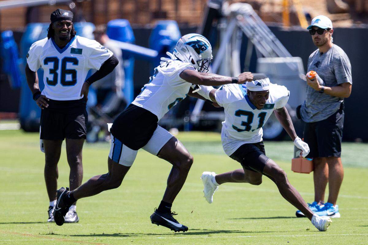 Jul 26, 2025; Charlotte, NC, USA; Carolina Panthers cornerback Michael Jackson (2) and cornerback Corey Thornton (31) put in extra reps after practice during training camp. 