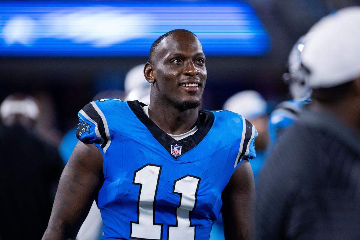Aug 8, 2025; Charlotte, North Carolina, USA; Carolina Panthers linebacker Nic Scourton (11) walks the sideline during the third quarter against the Cleveland Browns at Bank of America Stadium. Mandatory Credit: Scott Kinser-The USAToday Network via Imagn Images