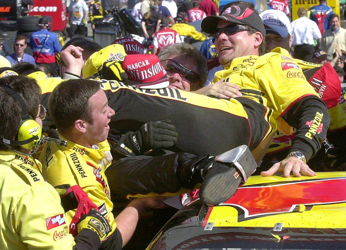 2/26/01 NASCAR driver Steve Park smiles as he rolls back across the roof of his Pennzoil Chevrolet after diving into members of his crew Monday afternoon. Park won the Dura-Lube 400 at North Carolina Motor Speedway in Rockingham, NC. JEFF SINER/STAFF