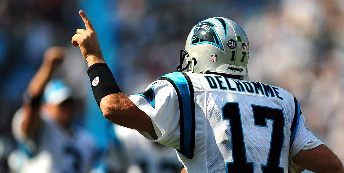 Carolina Panthers quarterback Jake Delhomme runs off the field after throwing a TD pass to wide receiver Muhsin Muhammad.