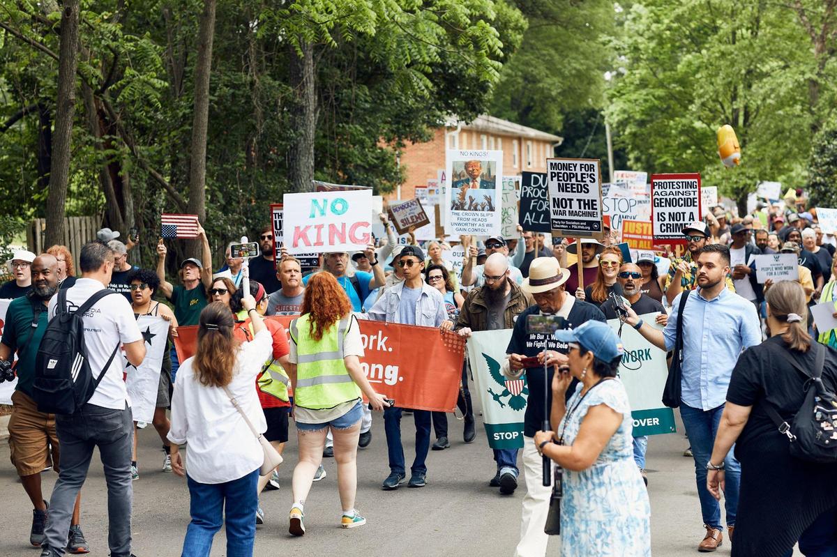 Protesters march on Central Avenue for the May Day anti-Trump protest in Charlotte Saturday.