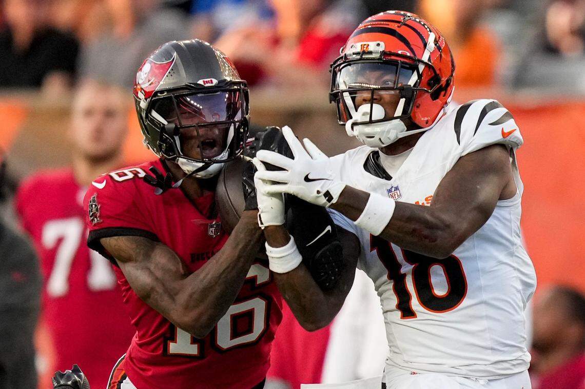 Tampa Bay Buccaneers cornerback Keenan Isaac (16) intercepts a pass intended for Cincinnati Bengals wide receiver Kwamie Lassiter II (18) in the second quarter of the NFL Preseason Week 1 game between the Cincinnati Bengals and the Tampa Bay Buccaneers at Paycor Stadium in downtown Cincinnati on Saturday, Aug. 10, 2024.