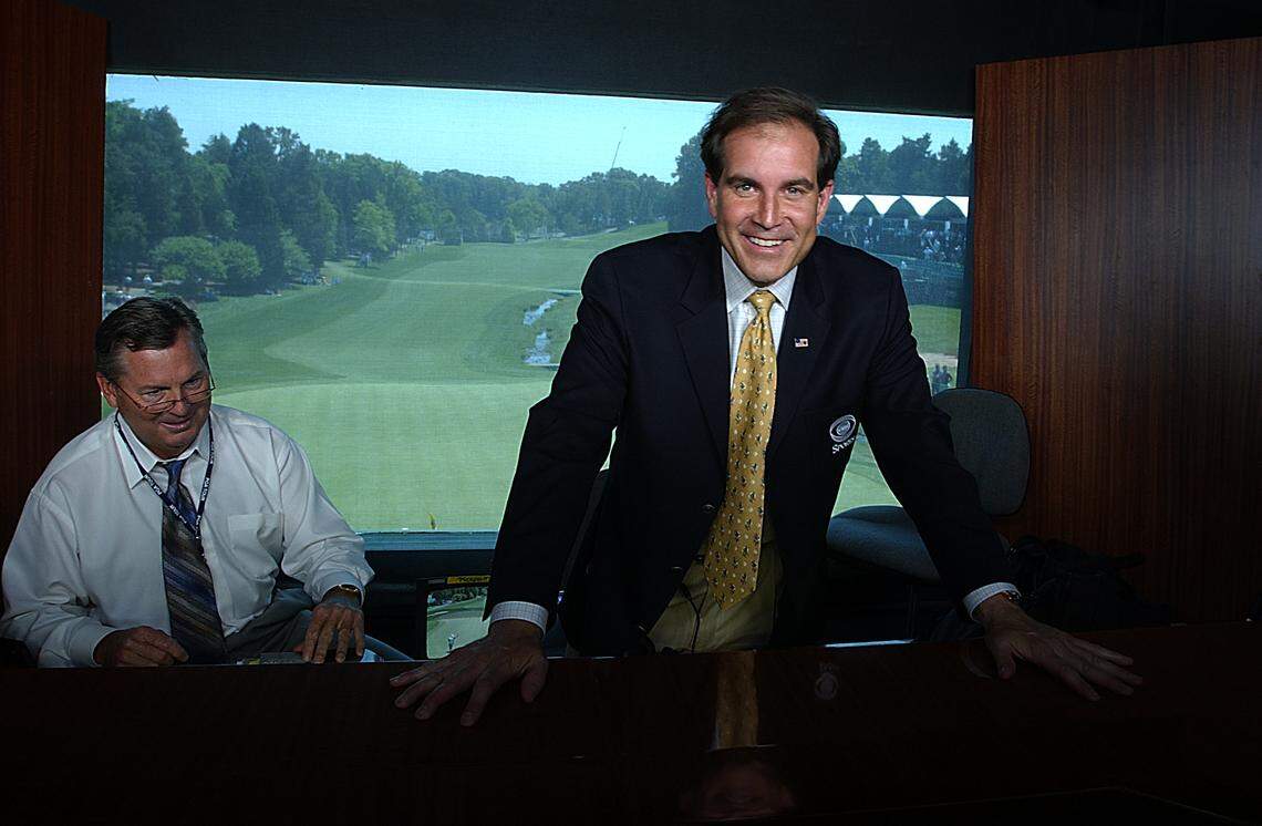 In 2004, Charlotte native Jim Nantz poses in his loft high above the 18th green at Quail Hollow Club in the CBS booth. To his left is fellow announcer Lanny Wadkins.