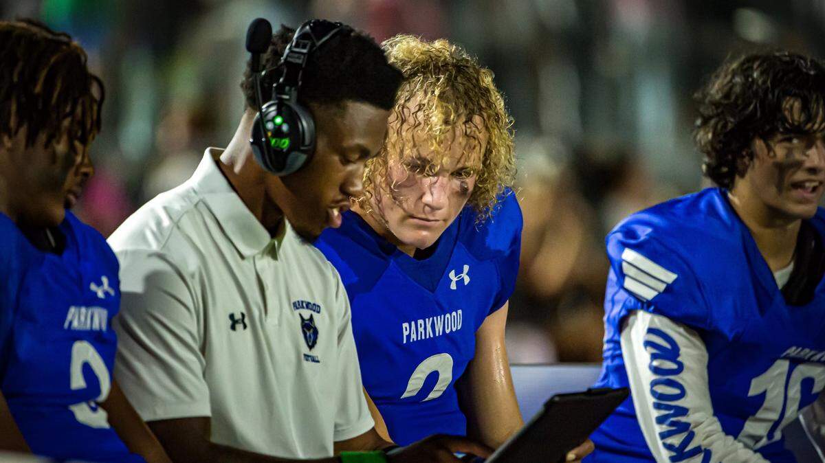 New Parkwood head coach Sam Mobley talking with players on the bench