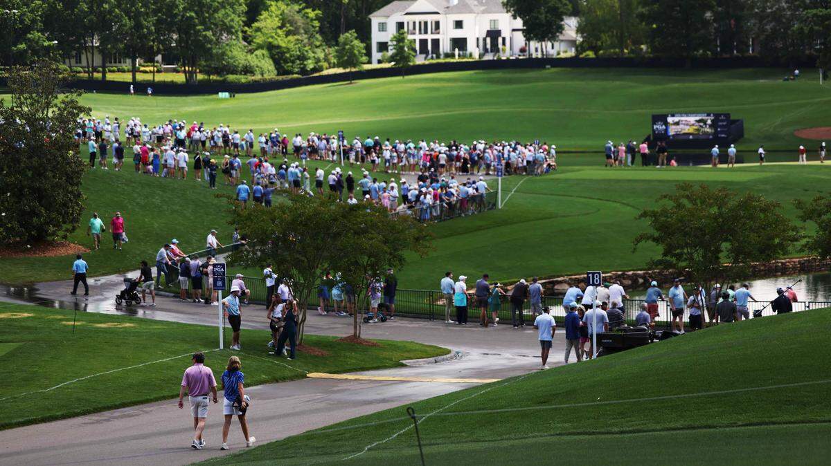 Spectators line up along the ropes as players practice on Tuesday, May 14, 2025 at Quail Hollow Club in Charlotte. The weather is expected to be in the mid-80s with a chance of scattered rain on Saturday.