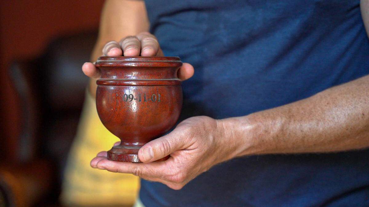 Doug Schroeder’s mother’s urn is in his living room.