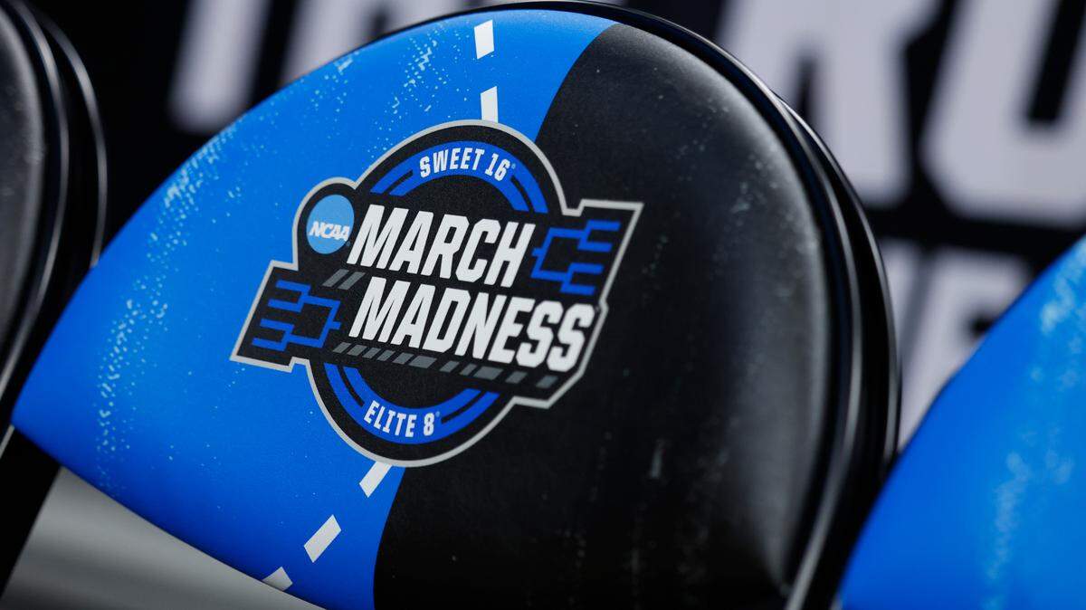 A detailed view of the March Madness logo during 2024 NCAA Tournament regional practice at Little Caesars Arena.