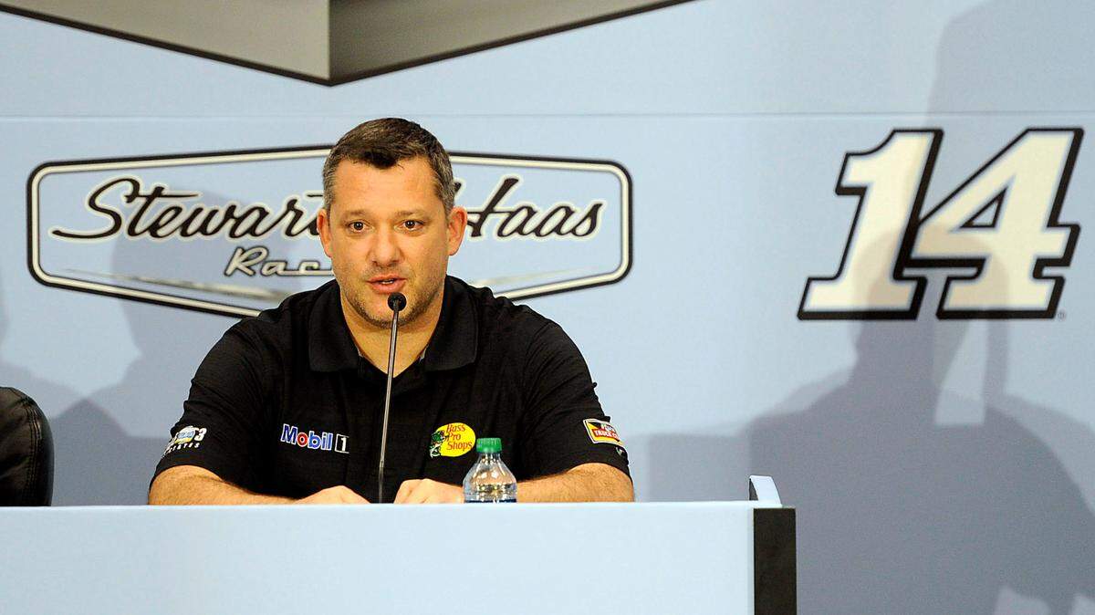 Former NASCAR Sprint Cup Series driver Tony Stewart (14) is a Stewart-Haas Racing co-owner