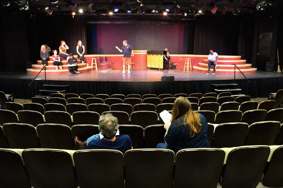 Pease Auditorium is an intimate, 13-row venue where the cast is up close with the audience. Ron Chisholm, left, director and choreographer, and Payton Dills, production stage manager, watch rehearsal for Pease Auditorium’s last theatrical show,  “The Music of the Night: An Andrew Lloyd Webber Revue.”