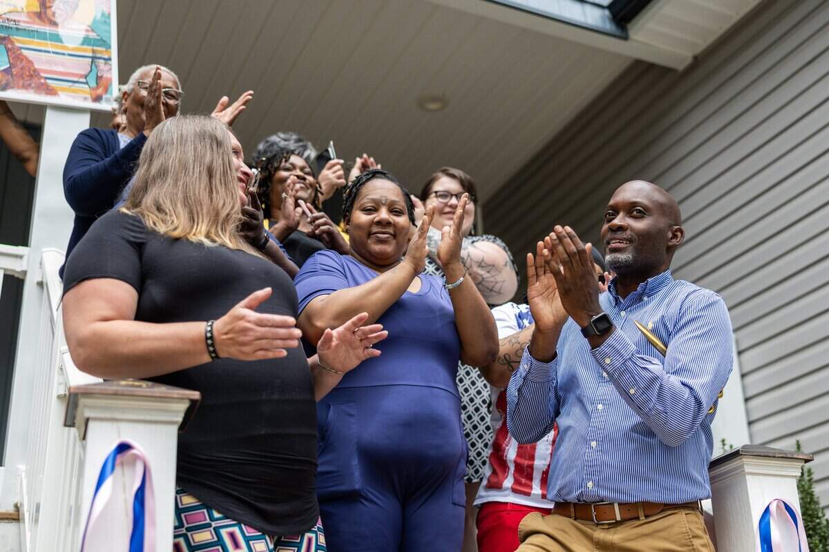 The ribbon cutting during the grand opening of A New Way of Life reentry home.