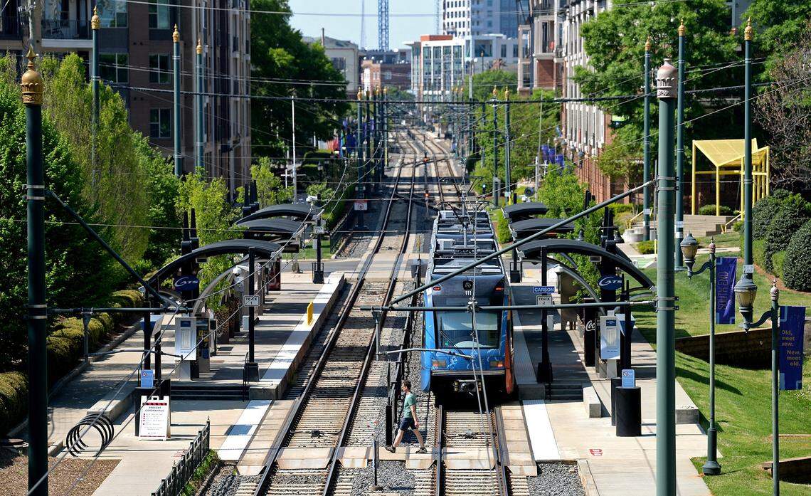 A train stops at the Lynx Blue Line light rail Carson stop.