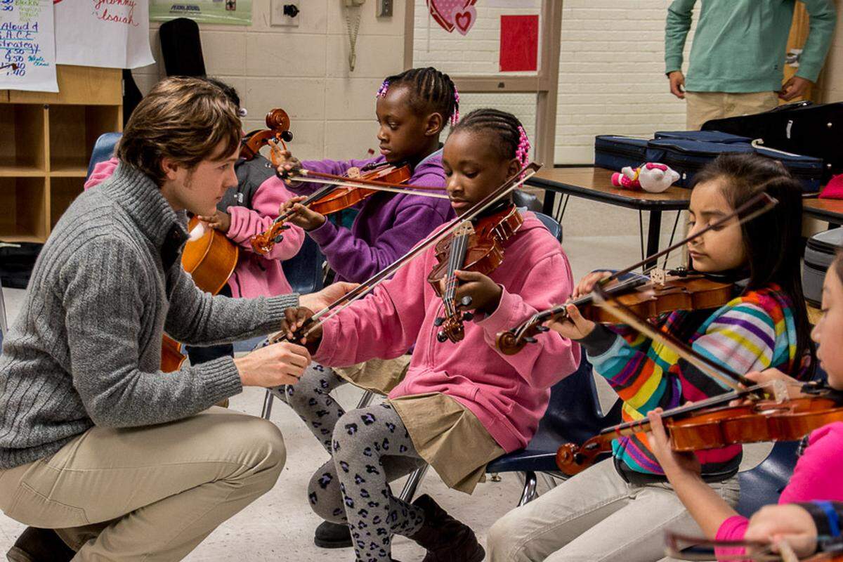 Double Bassist Taddes Korris works with students at Winterfield Elementary School in East Charlotte.