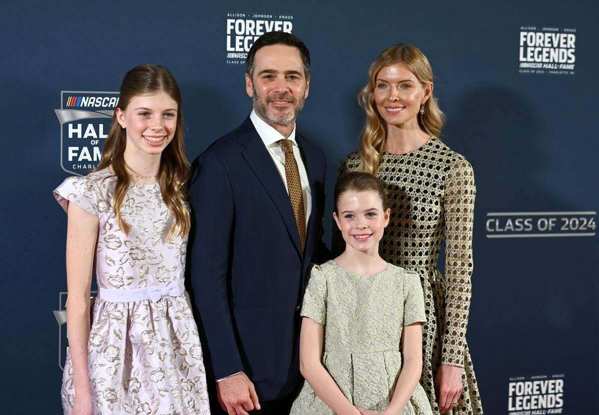 NASCAR Hall of Fame member Jimmie Johnson, center poses with his wife Chandra Janway, right and daughters Genevieve, left and Lydia, right, on the red carpet at the NASCAR Hall of Fame in Charlotte, NC on Friday, January 19, 2024.