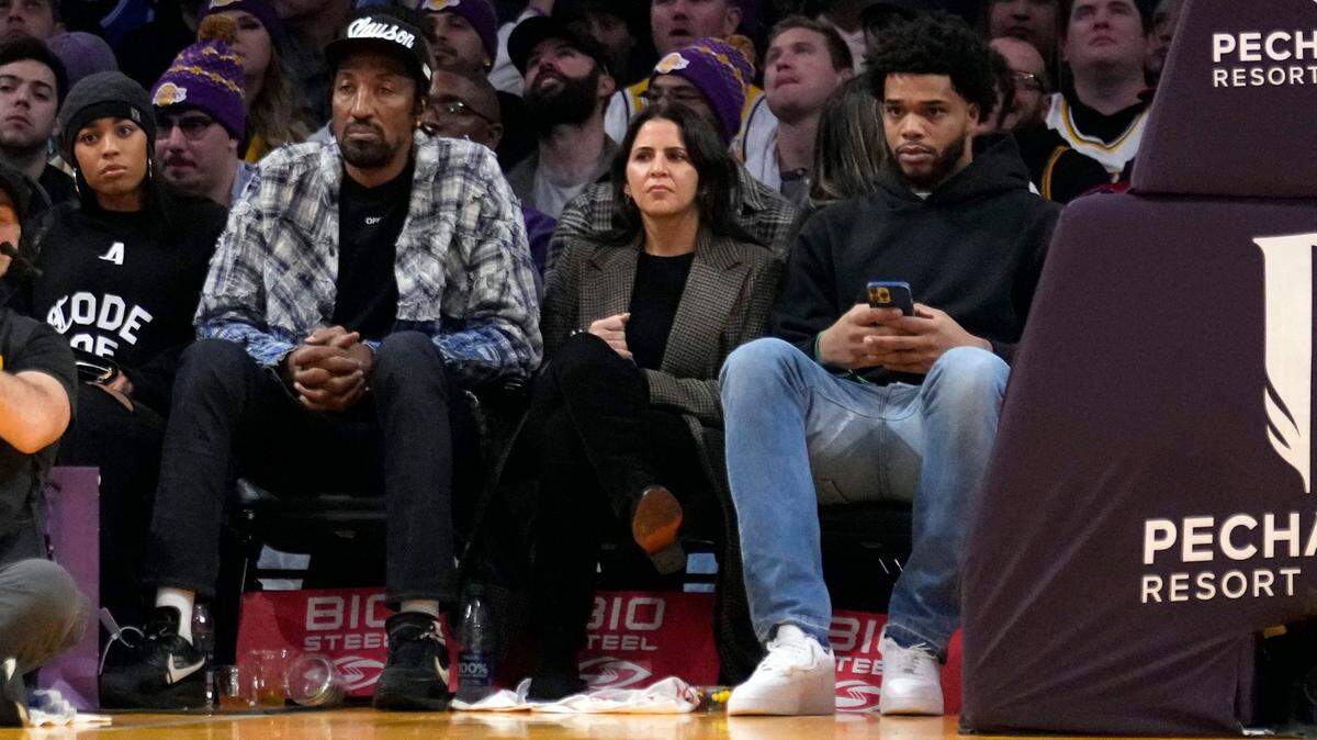 Former NBA players Miles Bridges, right, and Scottie Pippen, second from left, watch the second half of a basketball game between the Los Angeles Lakers and the Charlotte Hornets on Friday, Dec. 23, 2022, in Los Angeles. (AP Photo/Marcio Jose Sanchez)