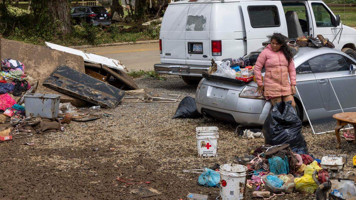 Residents in Clyde begin cleaning up on Saturday, Sept. 28, 2024 after massive flooding damaged dozens of homes and businesses. The remnants of Hurricane Helene caused widespread flooding, downed trees, and power outages in western North Carolina.