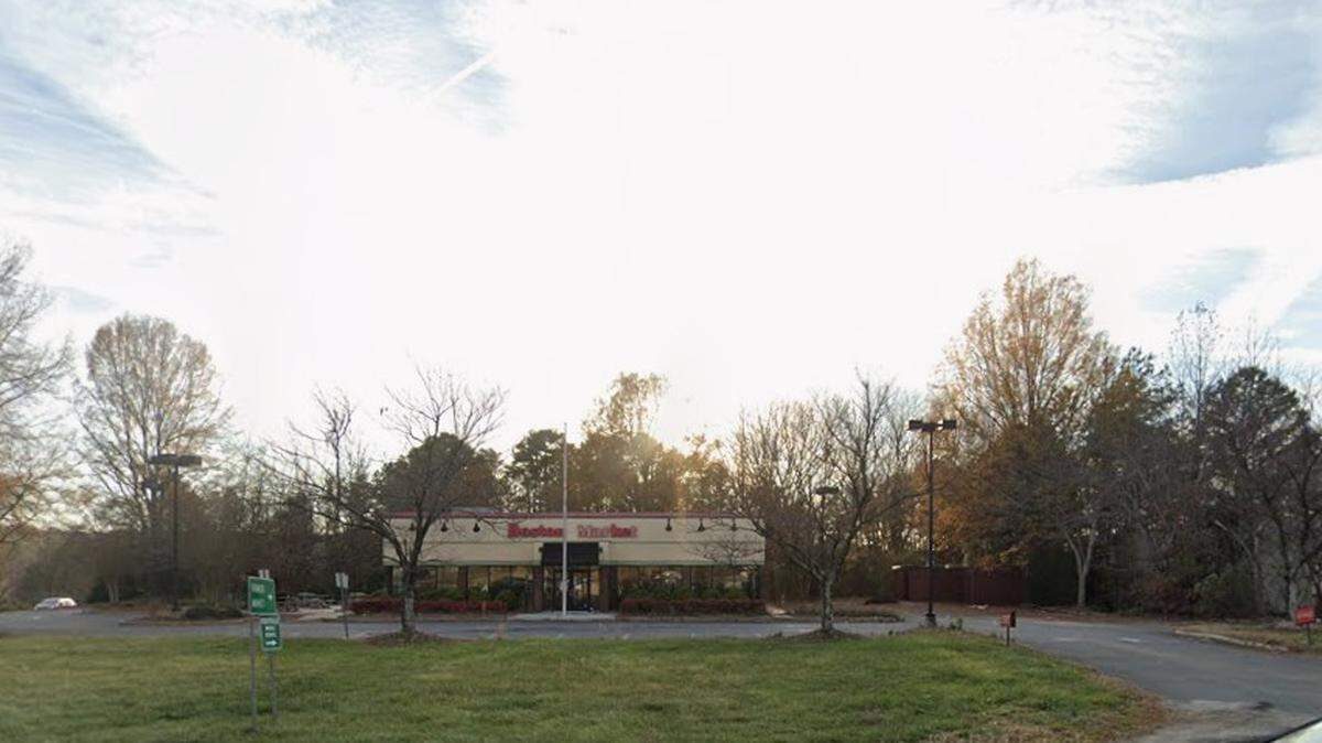 A town of Matthews battalion chief was arrested and charged in the burning of this former Boston Market location on East Independence Boulevard.