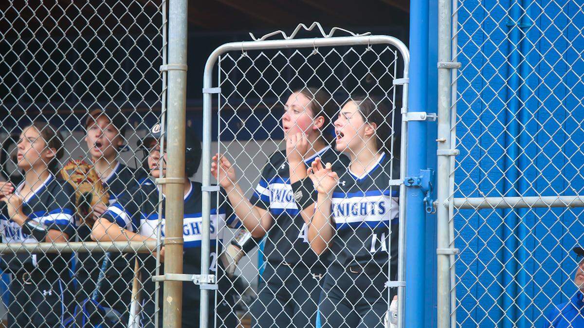 Charlotte Christian players cheer on their team as they start to fall behind