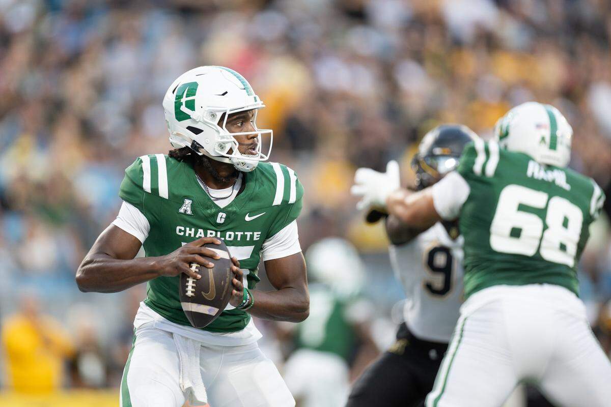 Charlotte 49ers quarterback Conner Harrell looks to pass against the Appalachian State Mountaineers during the Duke's Mayo Classic at the Bank of America Stadium in Charlotte, N.C., on Friday, August 29, 2025.