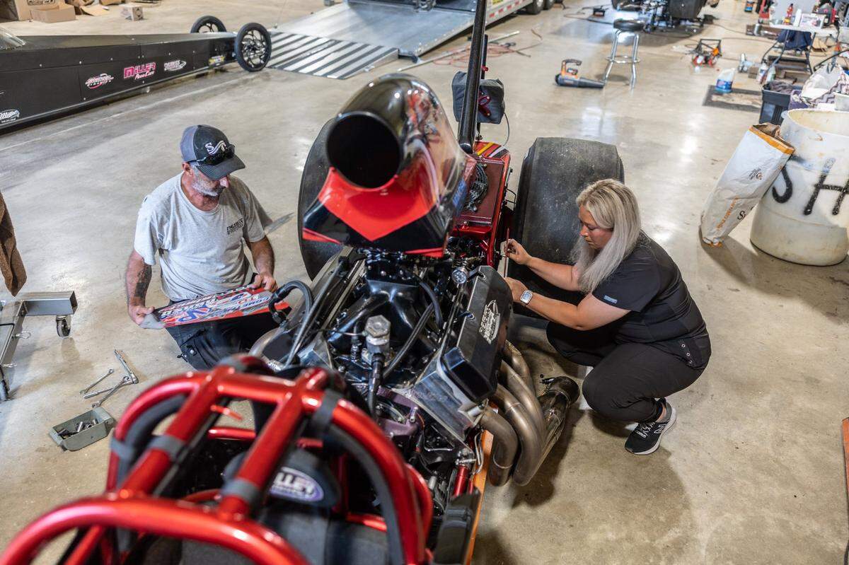 Lauren Freer, a radiation therapist and semi-professional drag racer, works on her cars with her father, Paul, who serves as her crew chief.