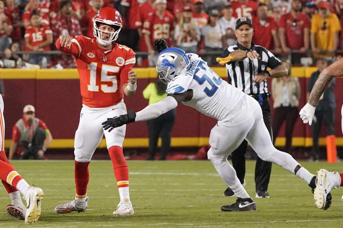 Kansas City Chiefs quarterback Patrick Mahomes (15) throws a pass as Detroit Lions defensive end Charles Harris (53) pressures during a 2023 game.