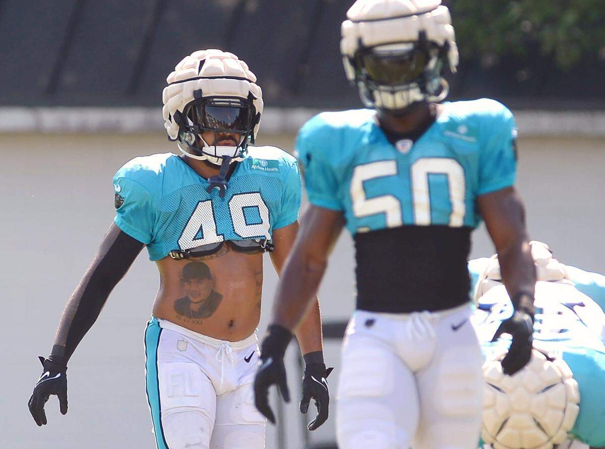 Carolina Panthers outside linebacker Frankie Luvu, left, prepares to begin drills with his teammates on Monday, August 8, 2022 at Wofford College in Spartanburg, SC.