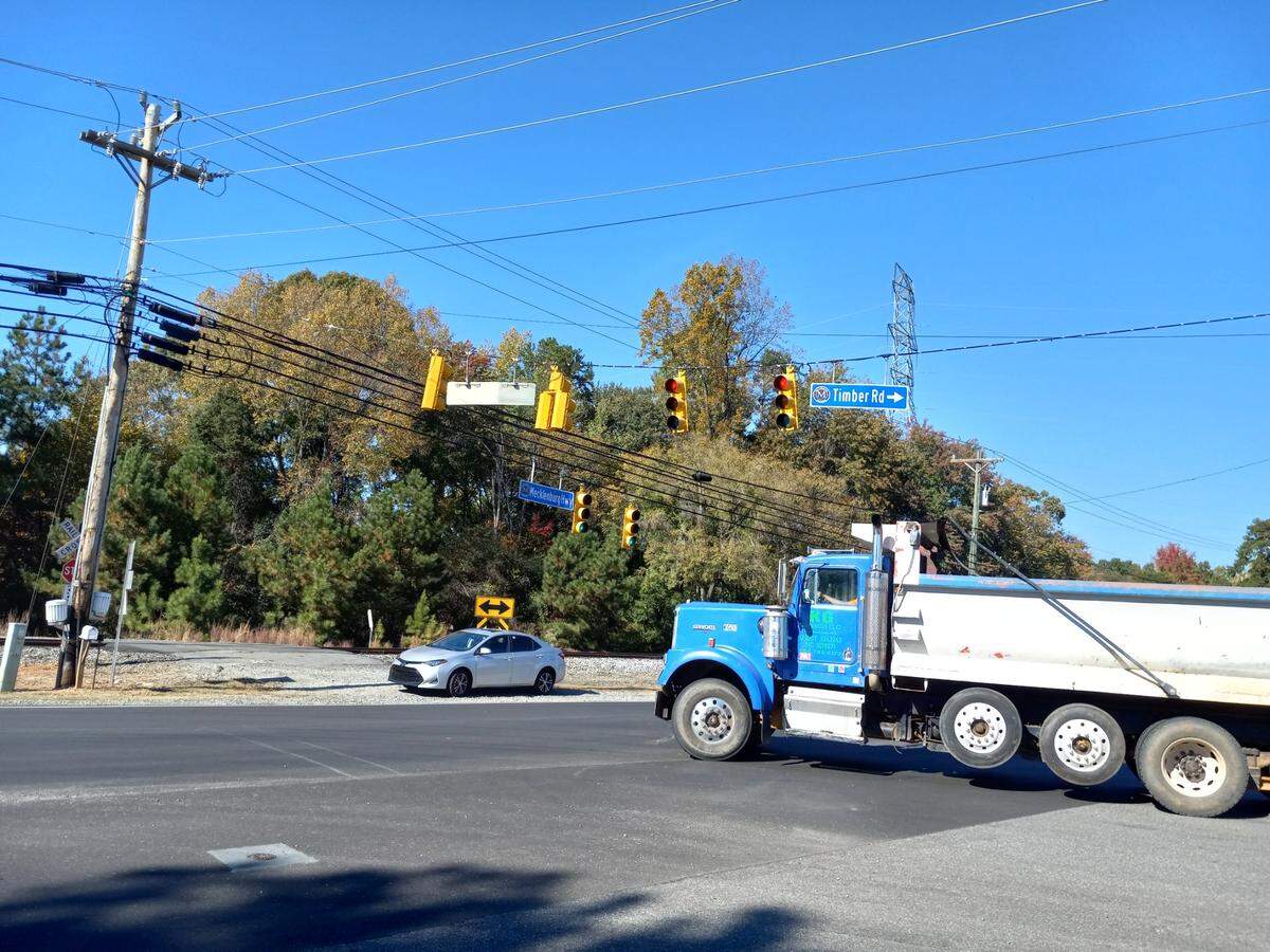 A trucker turns left off Timber Road onto Mecklenburg Highway (N.C. 115 South) in Mooresville on Monday, Oct. 24, 2022.