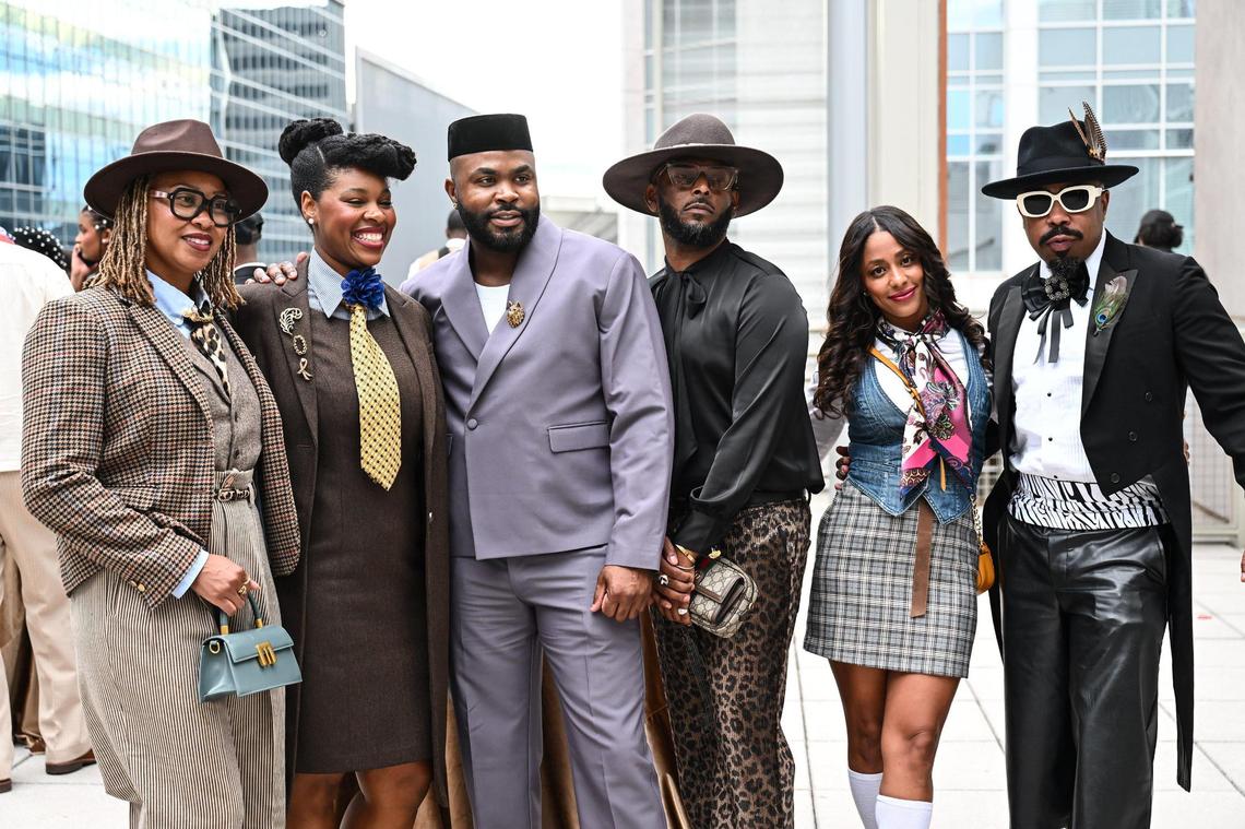 Attendees pose for a photo during “Superfine at the Gantt: Exploring Black Dandyism” at The Harvey B. Gantt Center, Friday, May 2, 2025, in Charlotte, N.C.