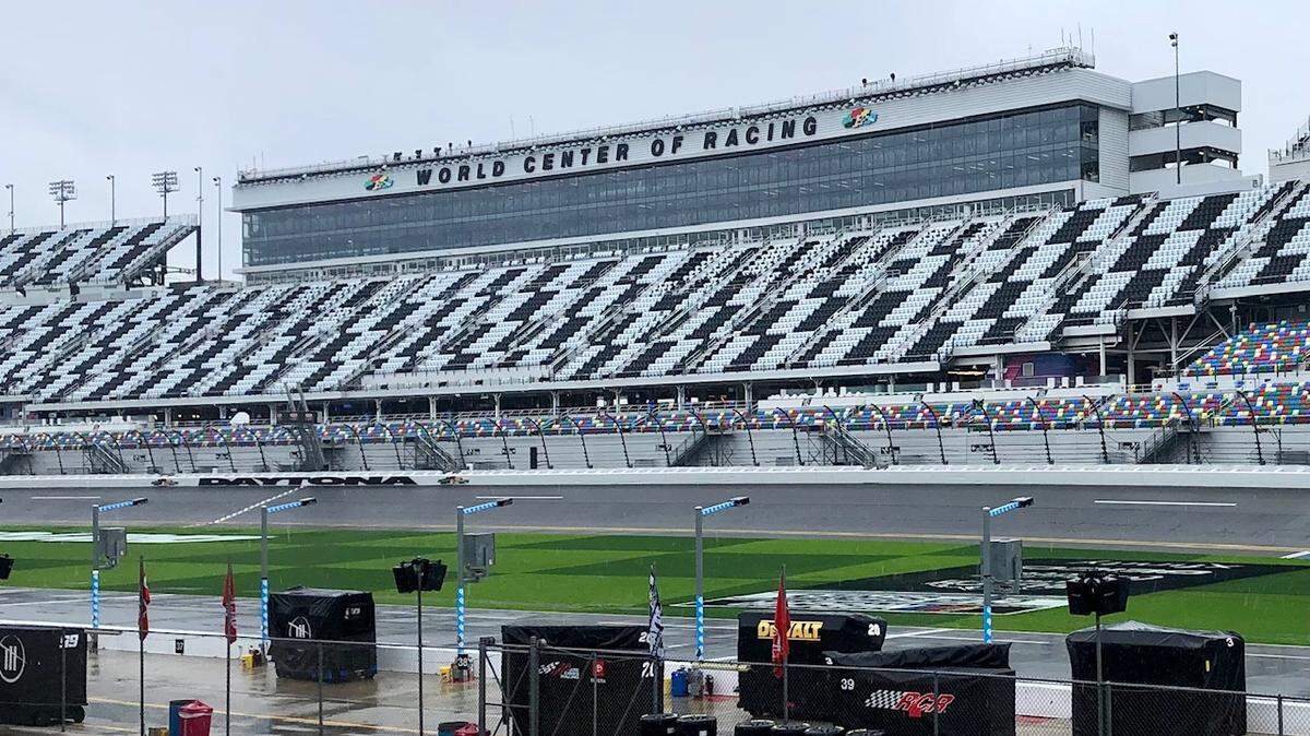 The checkered-flag stands sit vacant at the Daytona International Speedway on Feb. 18, 2024. The sold-out race was supposed to be run Sunday, but constant rain meant that it is postponed until Monday, Feb. 19, 2024, at 4 p.m.