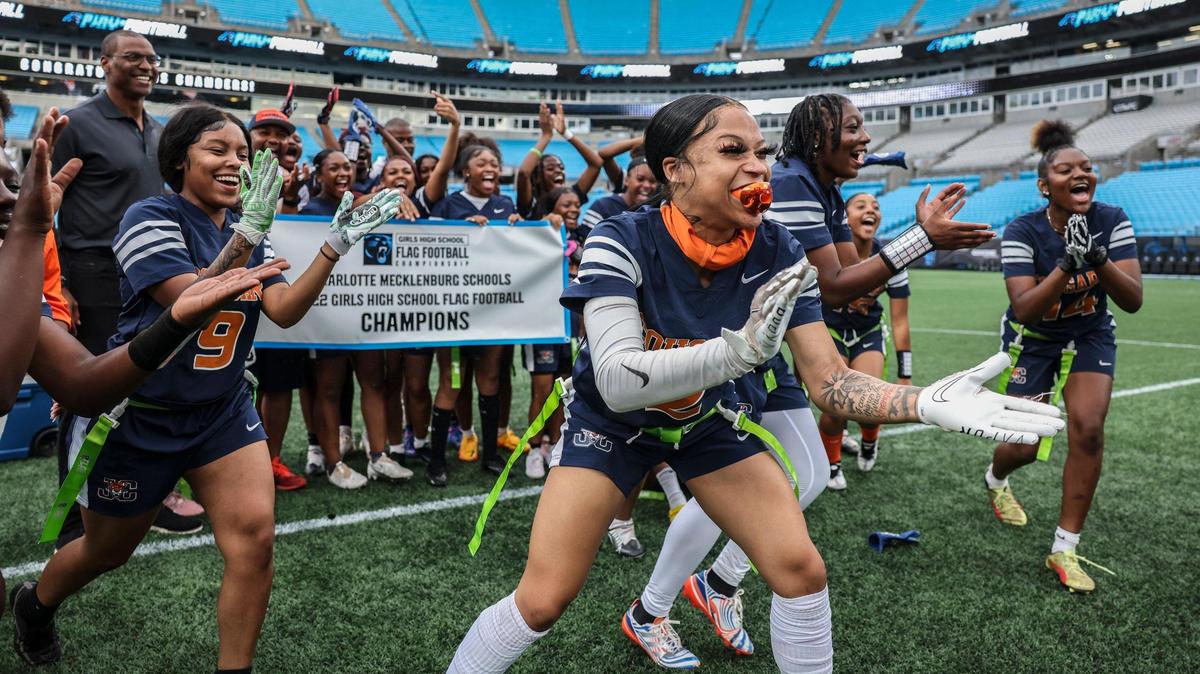 Chambers players celebrate their win against Butler for the first flag football championship game at the Bank of America Stadium in Charlotte, N.C., on Sunday, May 15, 2022.