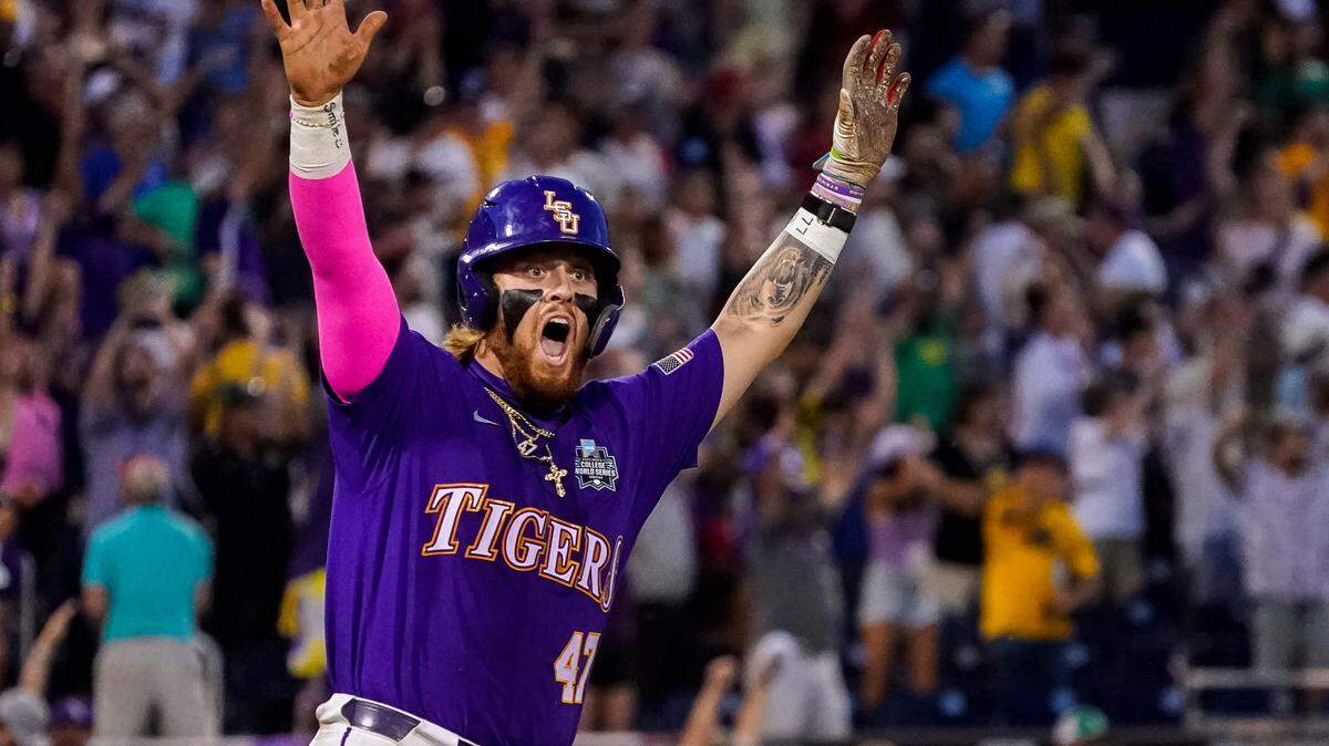 LSU Tigers third baseman Tommy White (47), formerly of N.C. State, celebrates after hitting a walk-off two-run home run to defeat the Wake Forest Demon Deacons in the eleventh inning at Charles Schwab Field Omaha. 