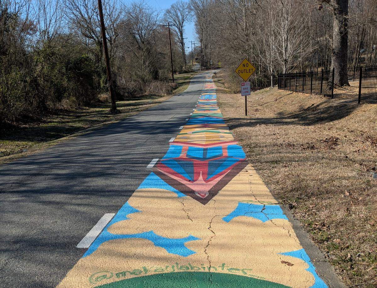 This mural by artist Makayla Binter decorates part of the Matthews Heritage Trail.