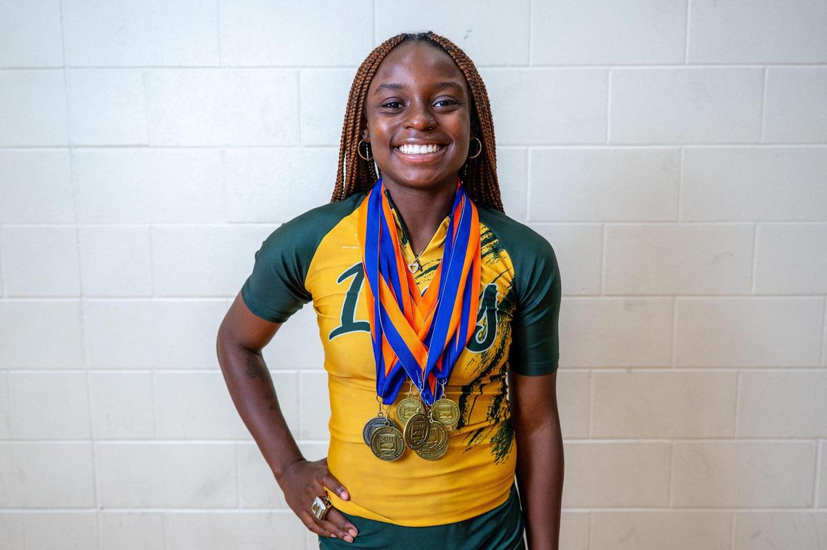Female athlete of the year Maya Love poses for a portrait at Independence High School in Charlotte, NC Wednesday, June 11, 2025. Love, a recent graduate of Independence High School, has been recognized as a top athlete in track and is set to continue her track career at the University of South Carolina.