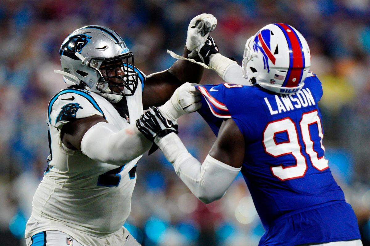 Carolina Panthers offensive tackle Ikem Ekwonu lines up against Buffalo Bills defensive end Shaq Lawson during the first half of an NFL preseason football game on Friday, Aug. 26, 2022, in Charlotte, N.C. (AP Photo/Jacob Kupferman)